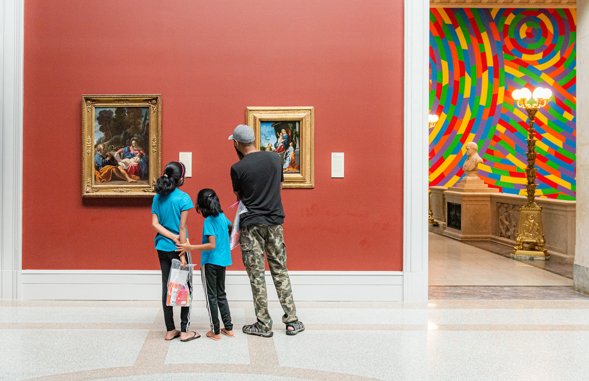 family looking at art in a museum