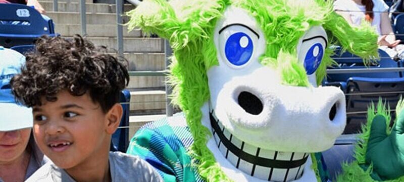 Hartford Yard Goats mascot with young fan