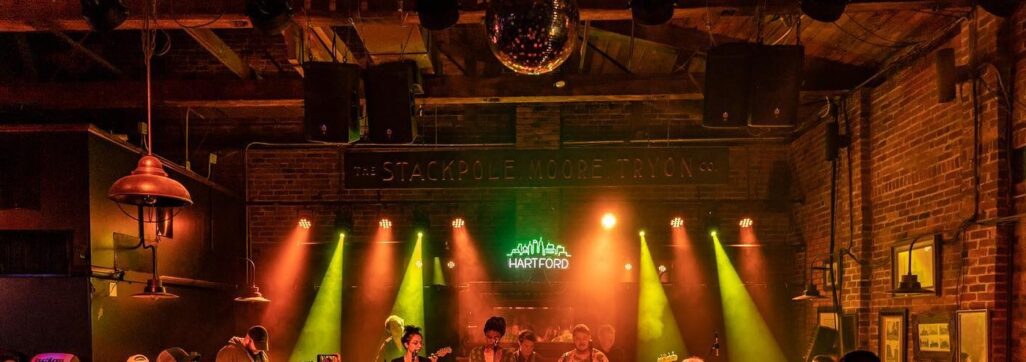 crowd dancing in a dark club