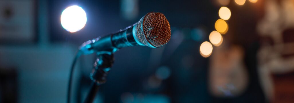 Close up of a classic microphone standing before a music show