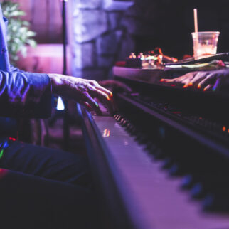 close up of man playing piano