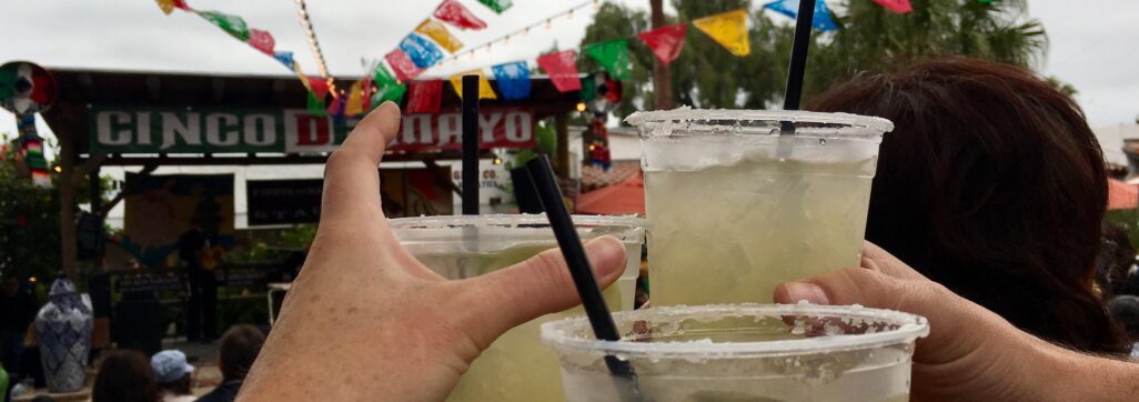Hands cheersing with margaritas Cinco de mayo celebration with margaritas