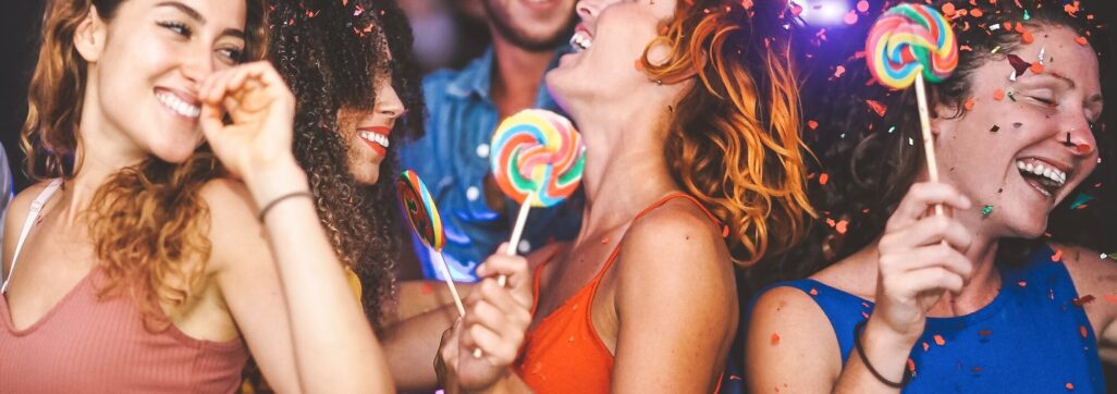 Happy friends doing party dancing in the nightclub