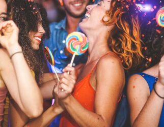 Happy friends doing party dancing in the nightclub