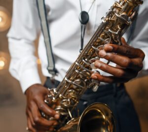 Male jazz performer plays the saxophone on stage