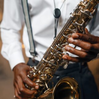 Male jazz performer plays the saxophone on stage