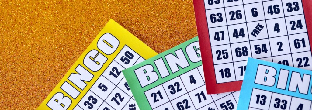 Many colorful bingo boards or playing cards for winning chips