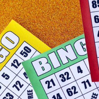 Many colorful bingo boards or playing cards for winning chips