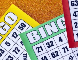 Many colorful bingo boards or playing cards for winning chips
