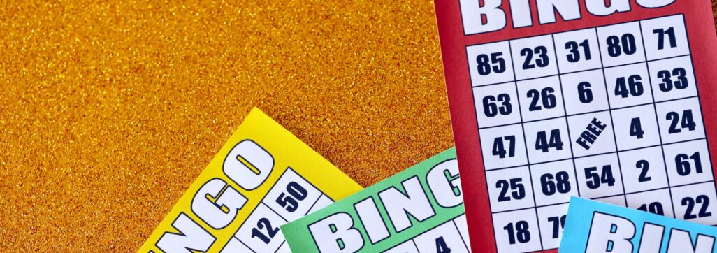 Many colorful bingo boards or playing cards for winning chips