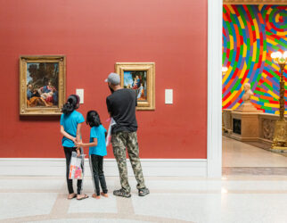 family looking at art in a museum